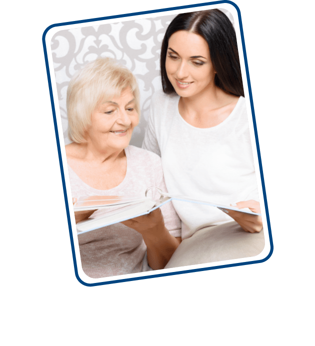 CDPAP paid family member caregiver reading book with senior woman